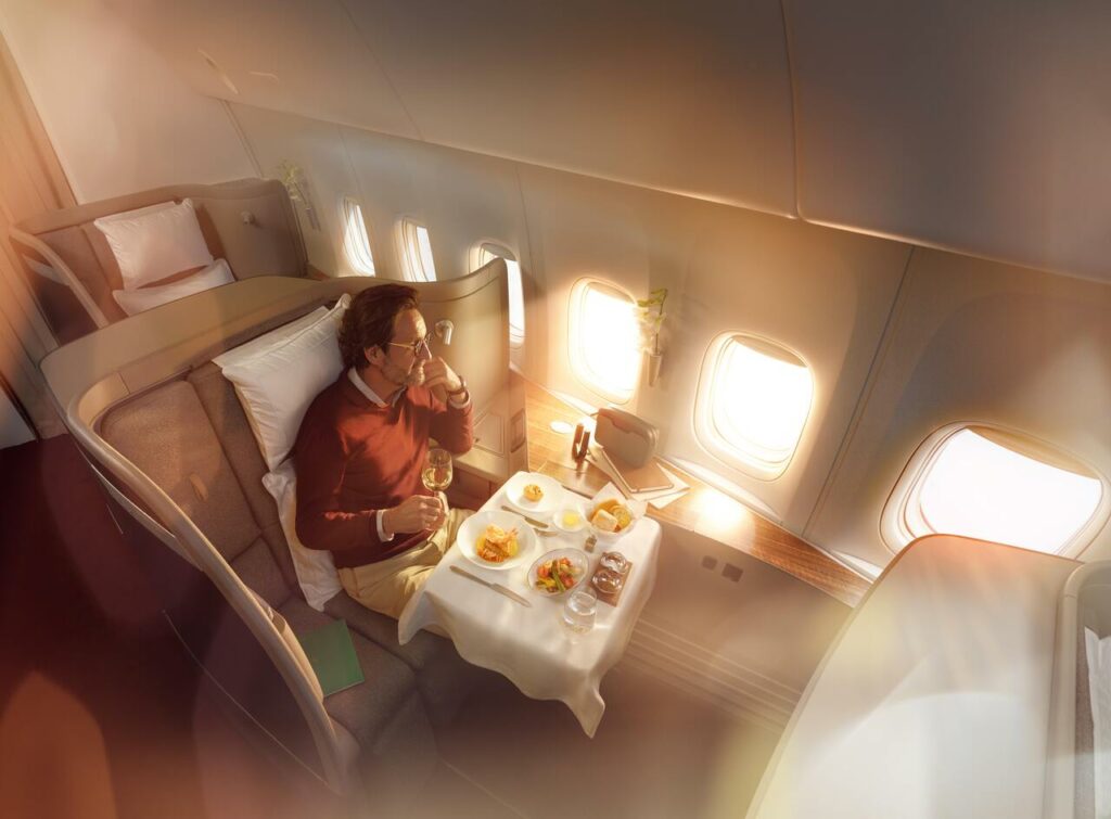 A passenger enjoys the extended First class service on a Cathay Pacific flight.