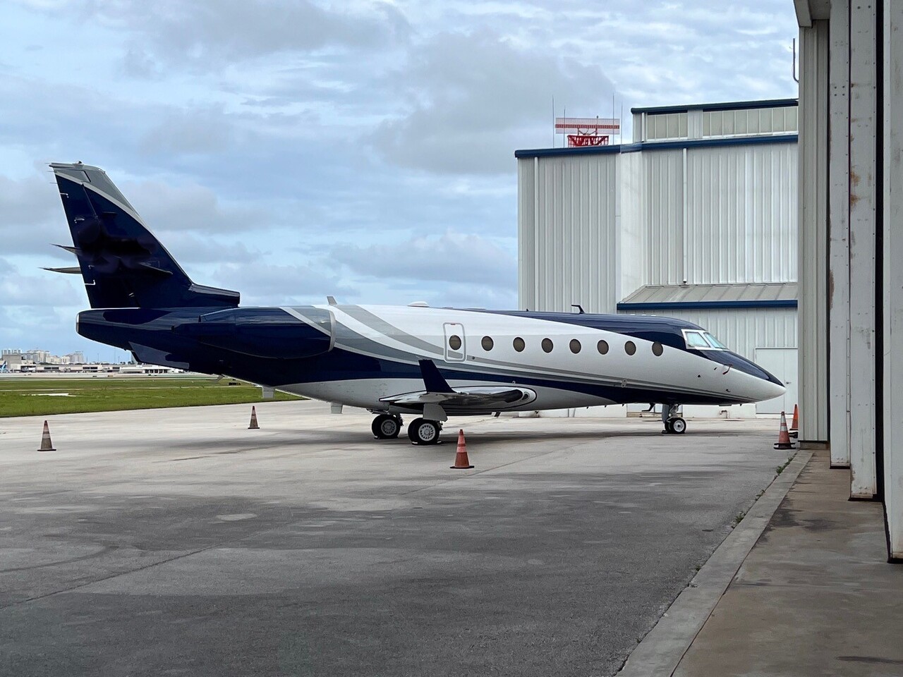 The new Alerion Aviation Gulfstream G200 long-range jet parked in front of the hangar.