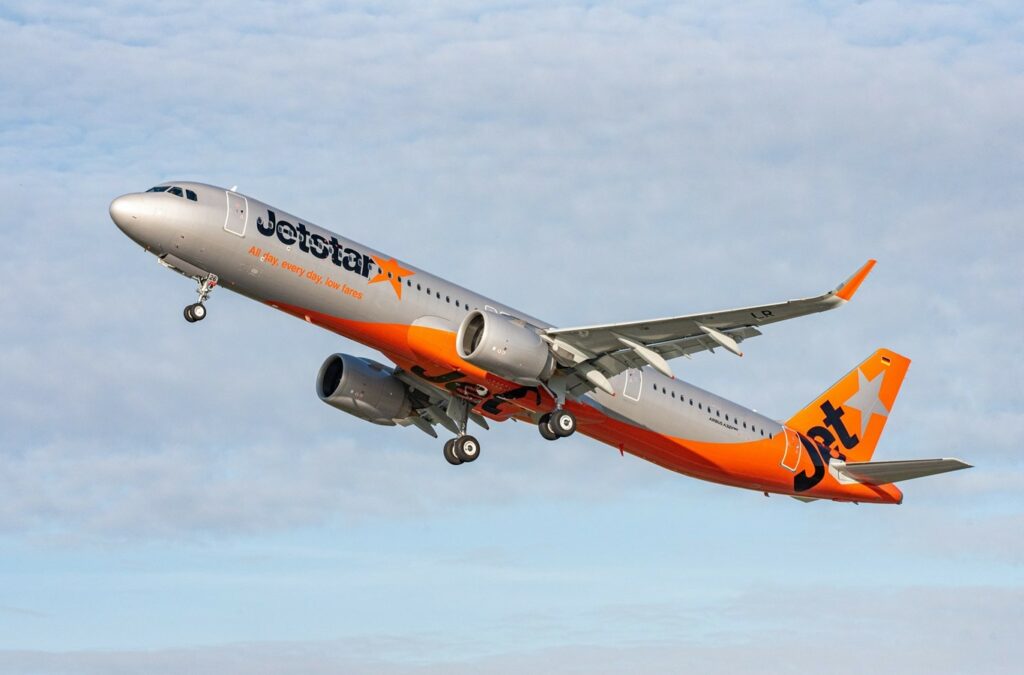 A Jetstar Airbus A321neo climbs after takeoff.