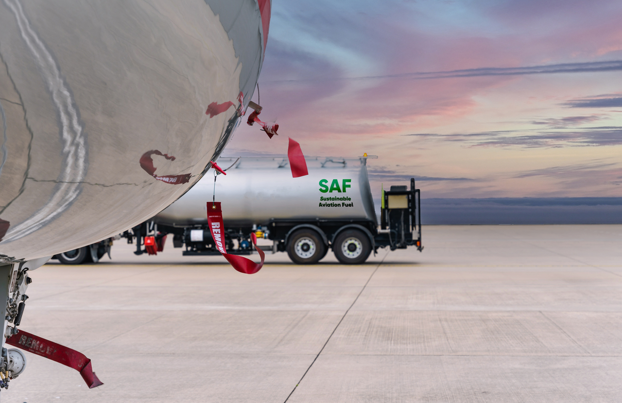 A VistaJet aircraft and SAF fuel tanker on the tarmac.