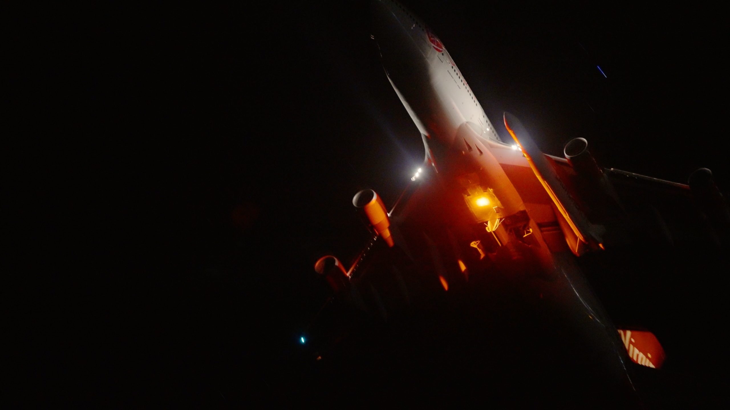 The Virgin Orbit 747 Cosmic Girl lifts off at night.