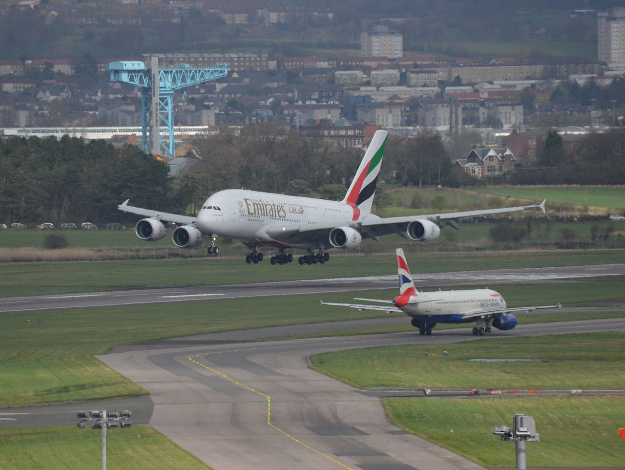 An Emirates flight takes off from Glasgow Airport.