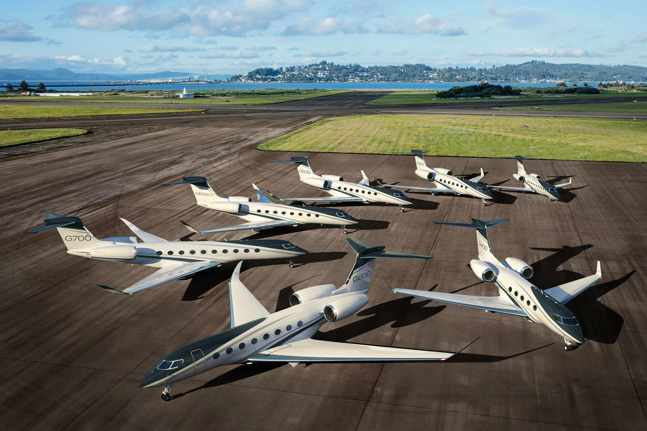 A range of Gulfstream Aerospace aircraft parked together on the tarmac