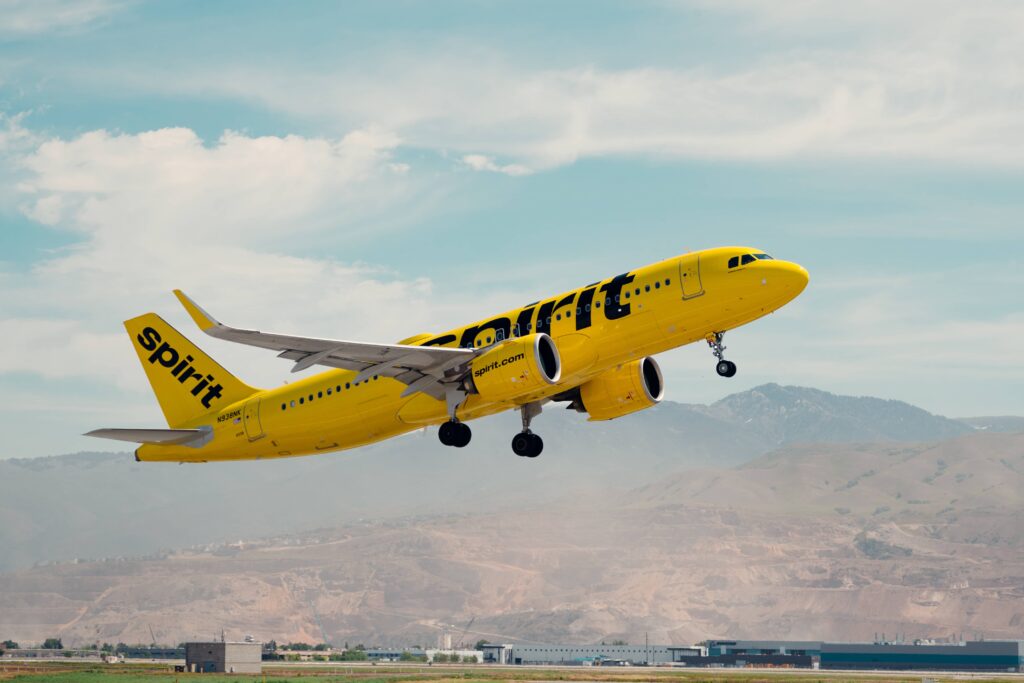 A Spirit Airlines Airbus climbs out after takeoff.