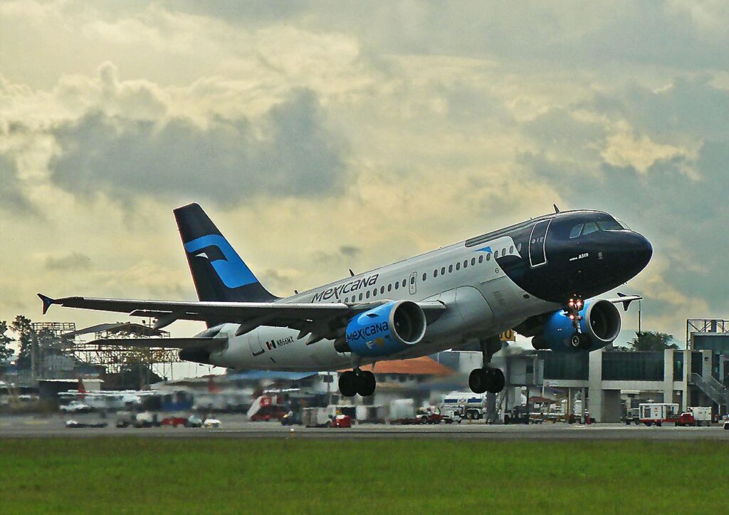 A Mexicana Airbus A319 takes off.