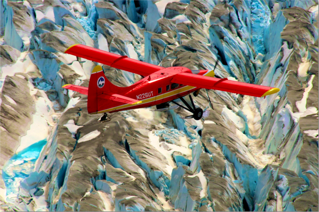 A NASA aircraft flies low over glaciers.