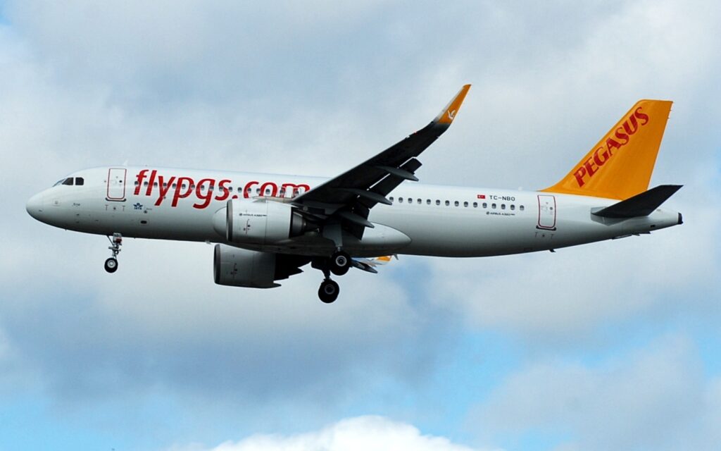A Pegasus Airlines Airbus A320 approaches with wheels down.