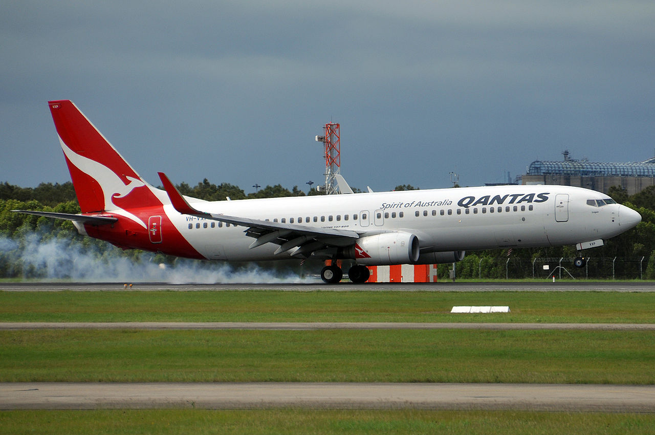 A Qantas Boeing 737-800 touches down.