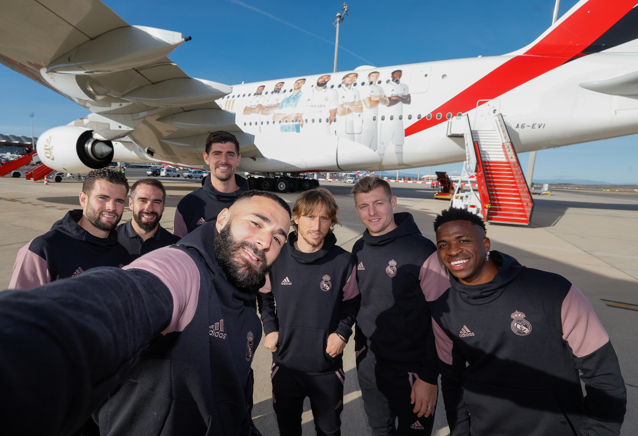 Real Madrid players pose in front of a custom Emirates A380 ahead of the Spanish Super Cup.