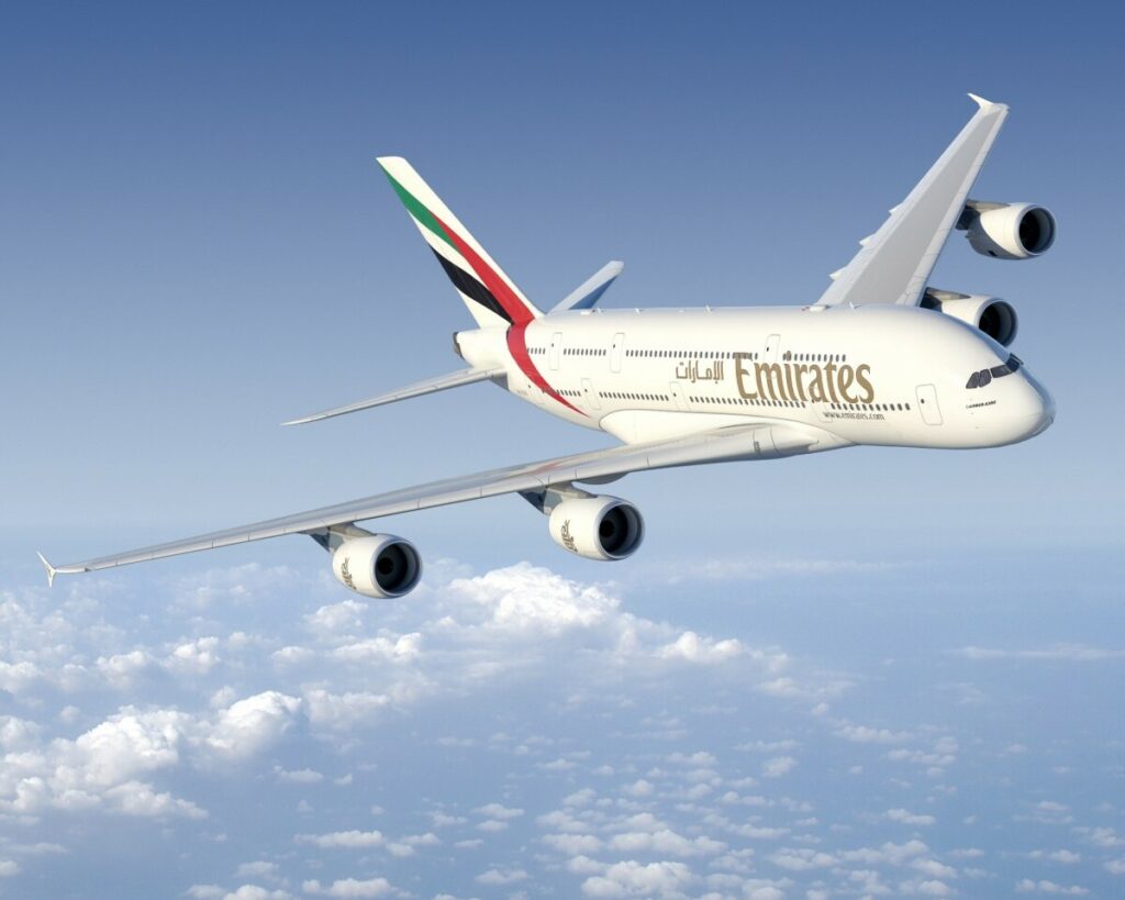 An Emirates Airbus A380 banks in flight.