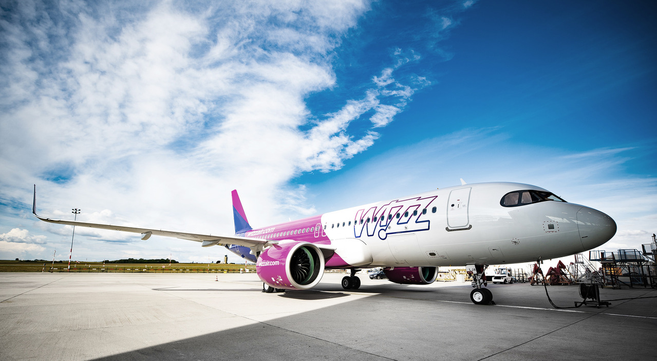 A Wizz Air aircraft parked at the terminal.