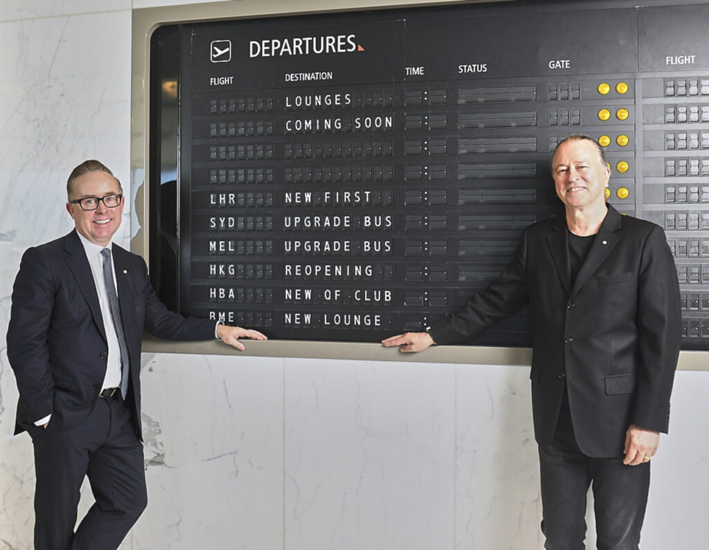 Qantas execs with a departure board showing new lounge openings.