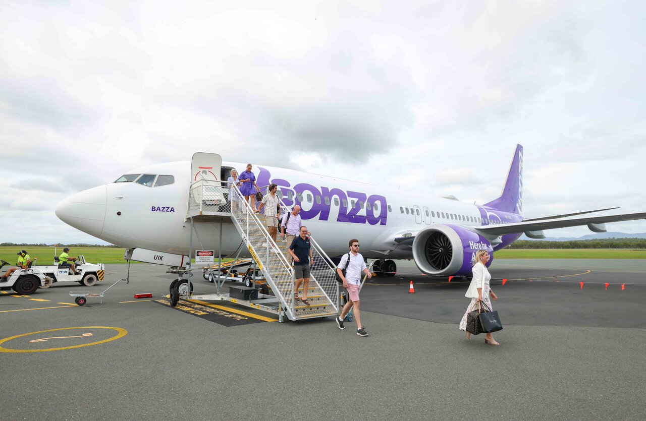 Passengers disembark a Bonza Airlines Boeing 737.