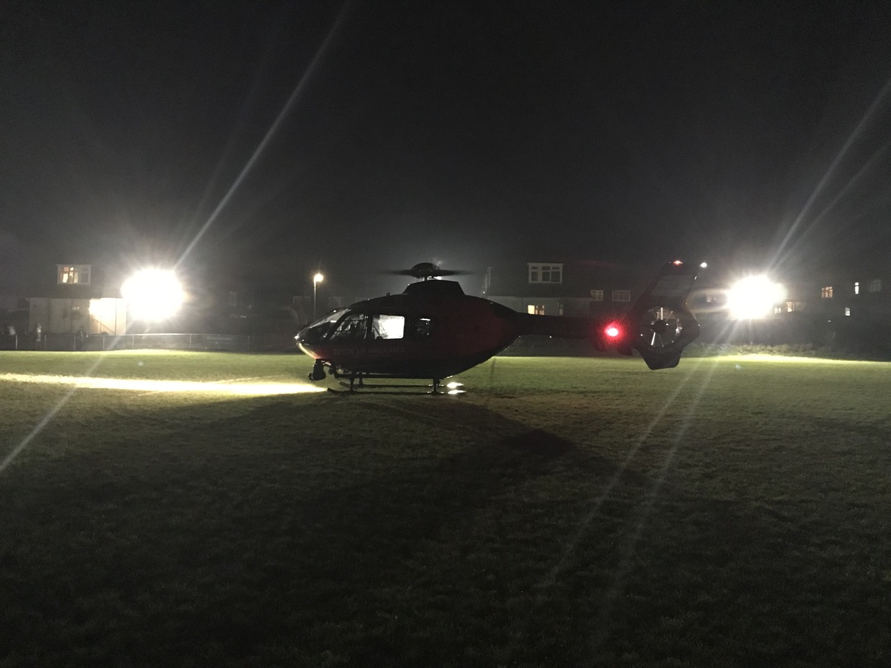 A Devon Air Ambulance helicopter at night.
