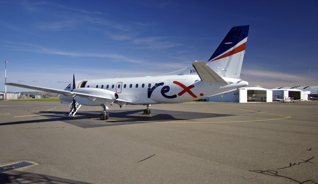 A Rex Airlines Saab 340 parked on the tarmac.