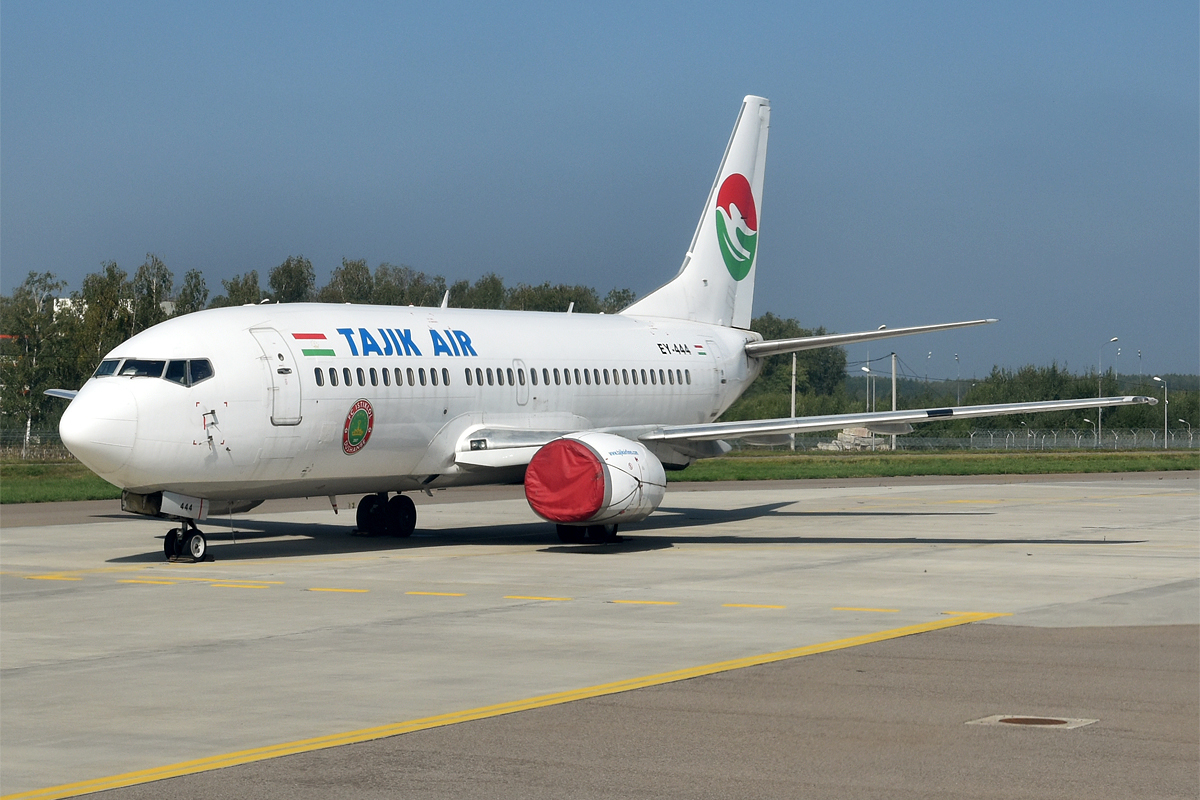 A Tajik Air Boeing 737 parked on the tarmac.