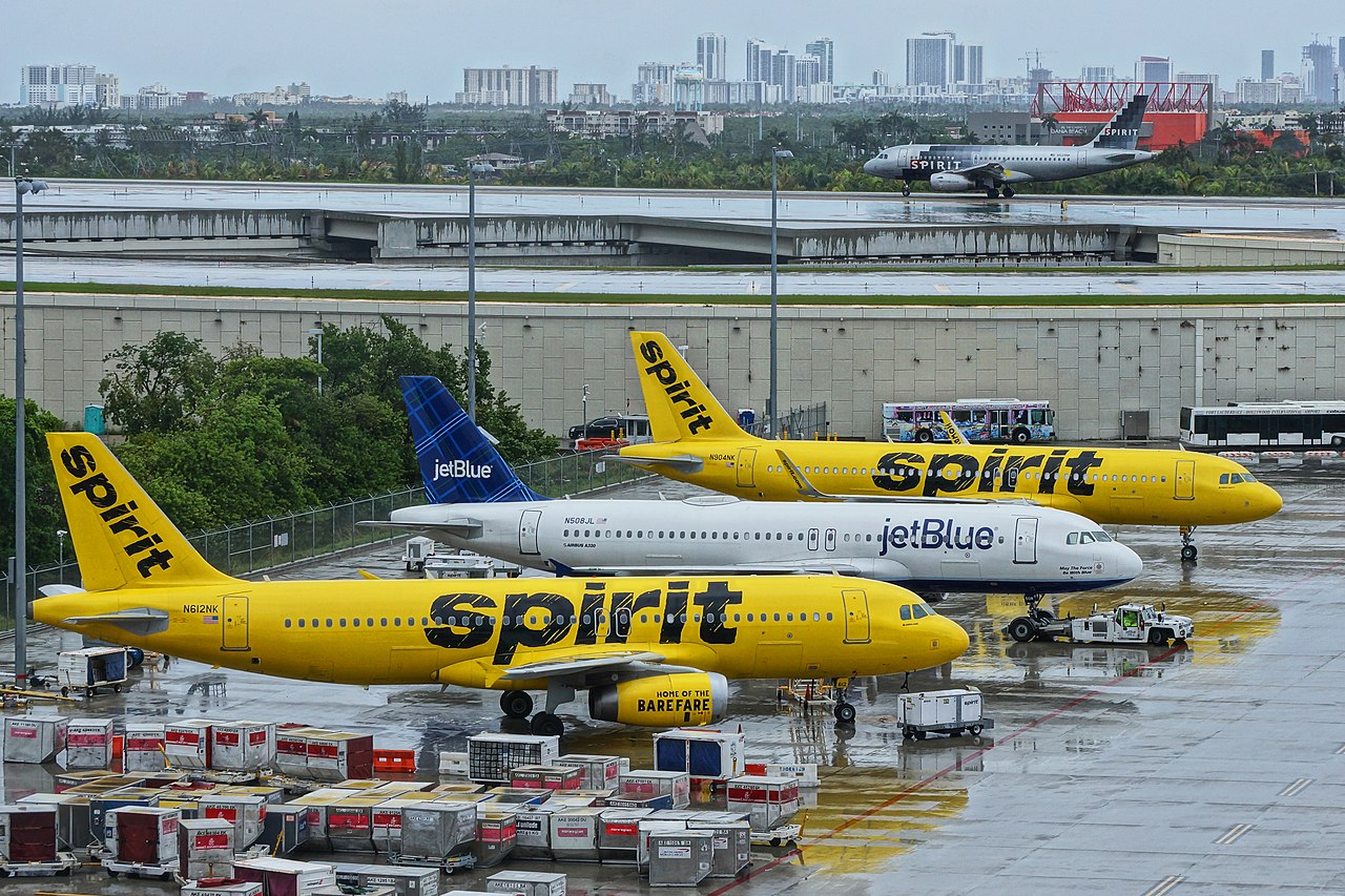 Spirit Airlines and JetBlue aircraft parked together.