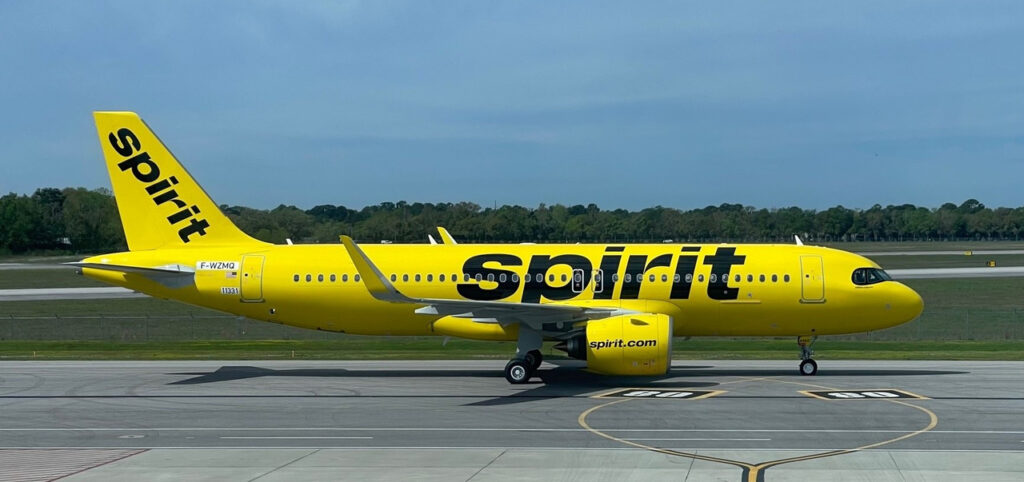 A new Spirit Airlines Airbus A320neo parked on the tarmac.