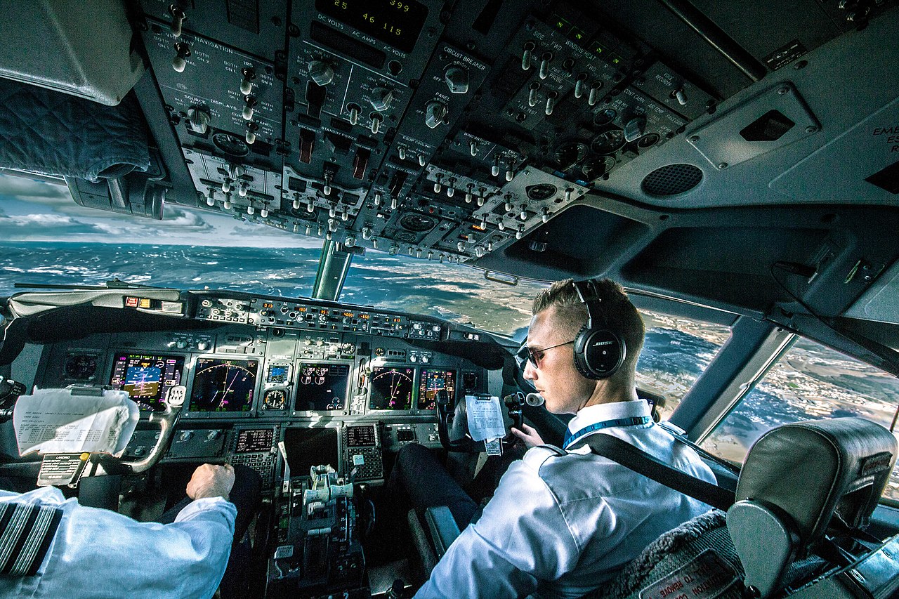 Two pilot operations on the flight deck of a Boeing 737.