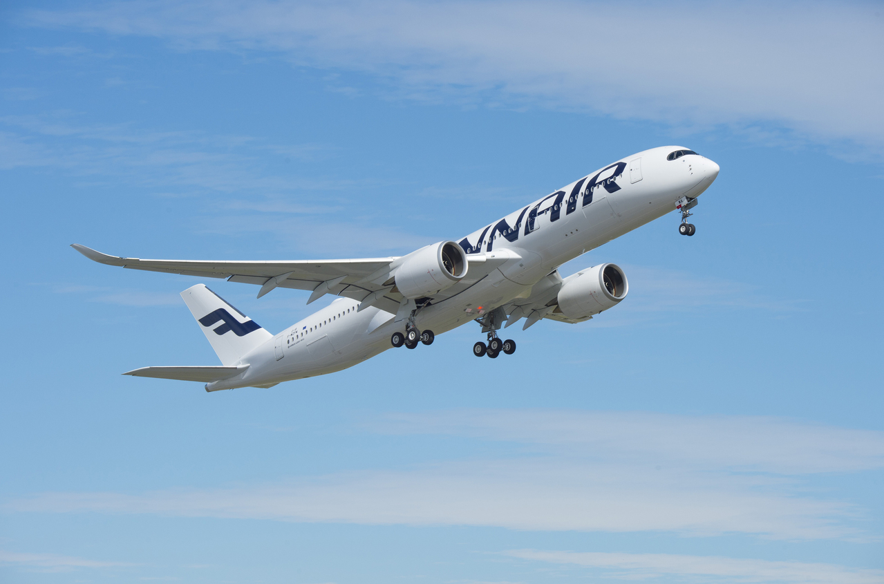 A Finnair Airbus A350 climbs after takeoff.
