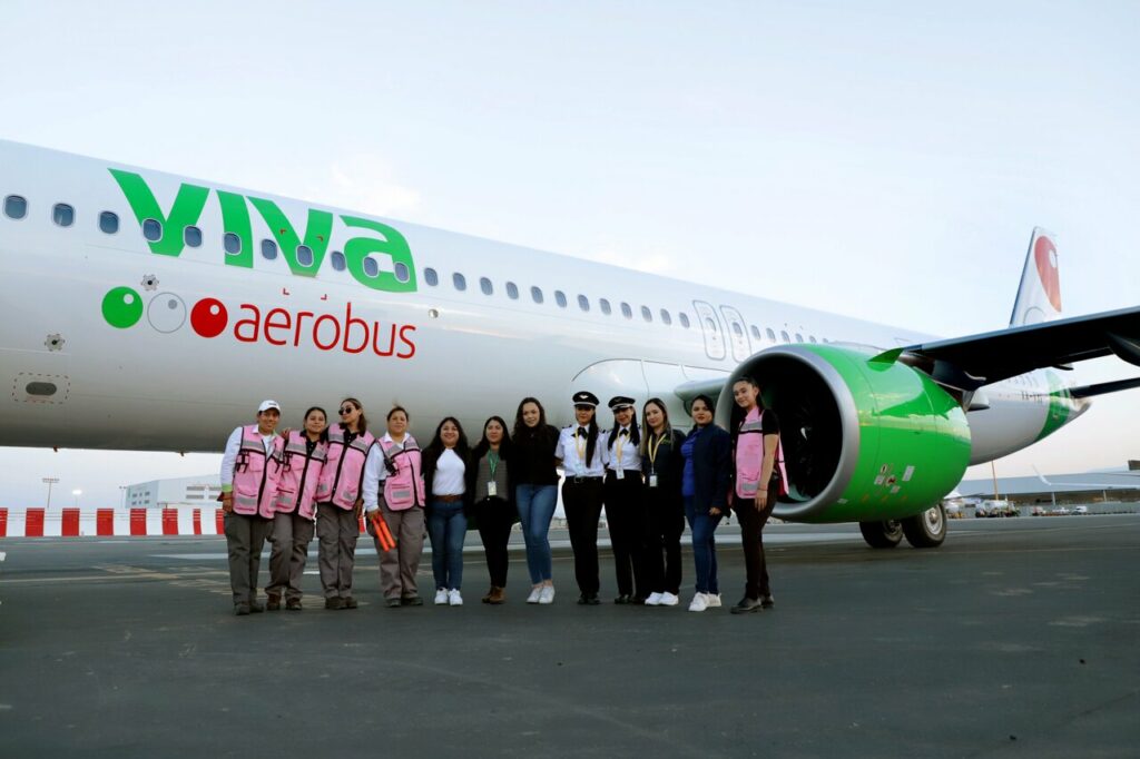 An all-women crew stand alongside a new Viva Aerobus Airbus A321neo.