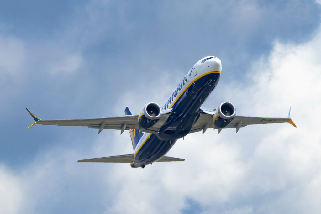 A Ryanair Boeing 737 passes overhead.