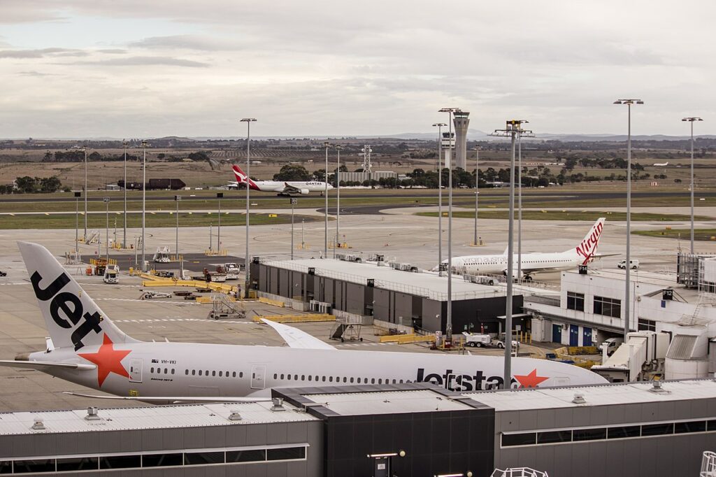 Jetstar, Virgin and Qantas aircraft parked at Melbourne Airport.