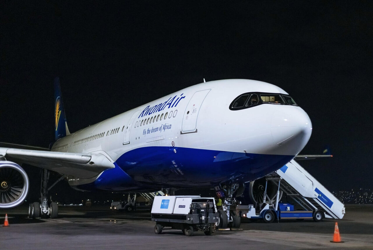 A new Rwandair Airbus A330 arrives at Kigali airport at night.