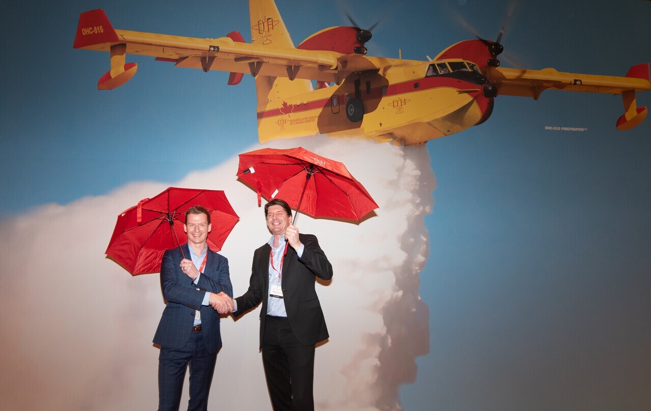 CEOs of De Havilland Canada and Fokker Services pose together for a photo.