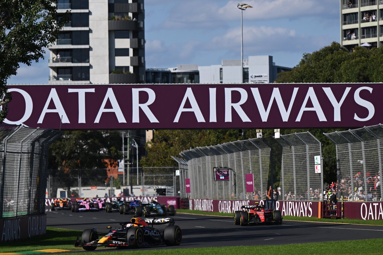A Qatar Airways promotional banner hags over Grand Prix track.