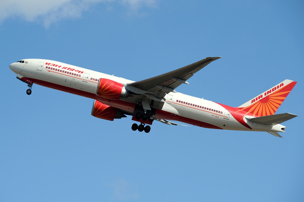 An Air India Boeing 777 climbs after takeoff.