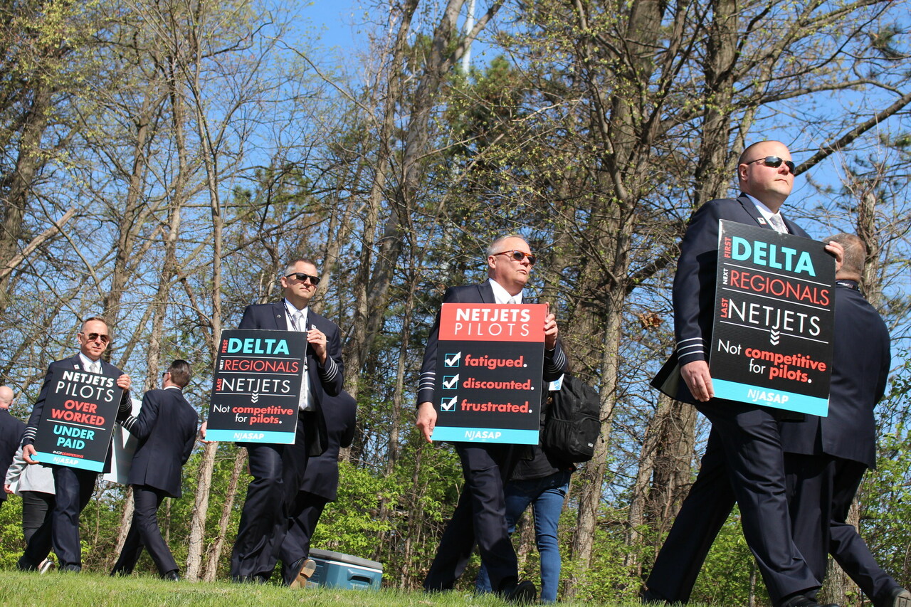 A group of Netjets pilots picket their company headquarters