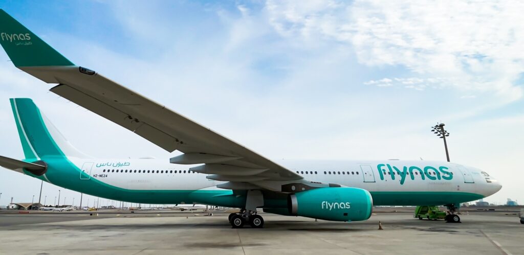 A flynas Airbs A330 parked on the apron.