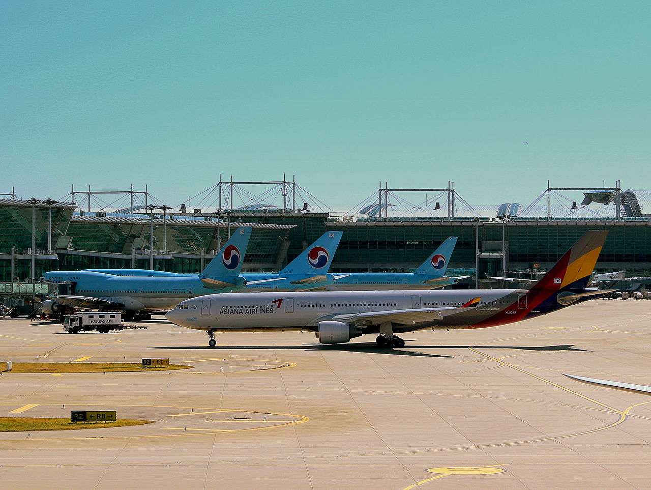 Korean Air and Asiana aircraft parked together at Seoul Incheon Airport.
