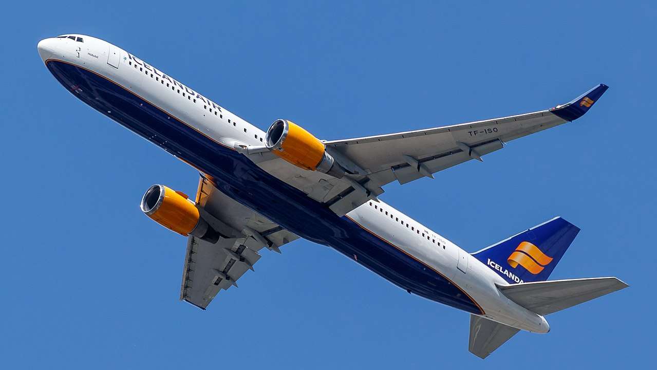 An Icelandair Boeing 767 passes overhead.