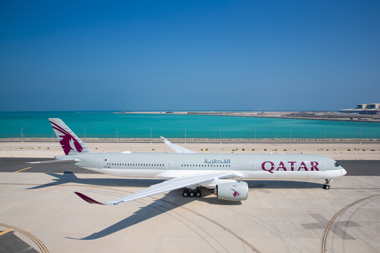 A Qatar Airways Airbus A350 parked on the tarmac.