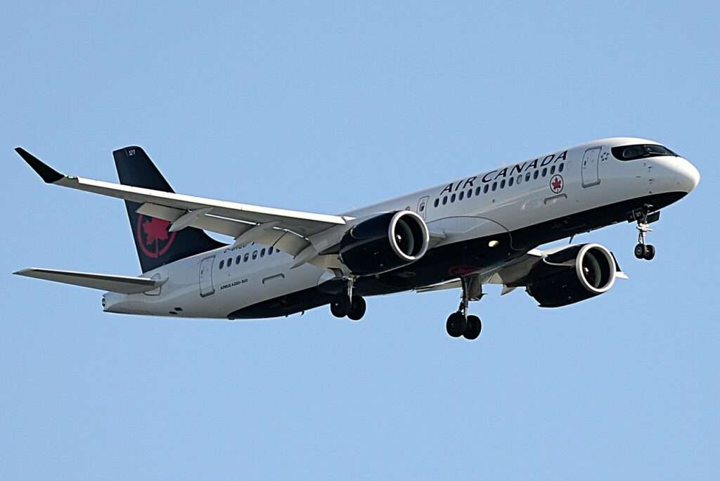 An Air Canada A220 approaches to land.