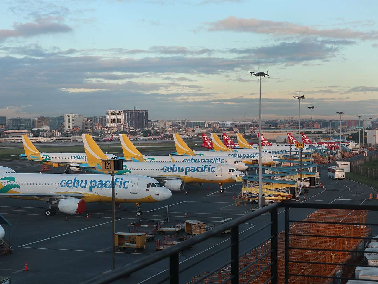 Cebu Pacific and Air Asia planes parked at Ninoy Aquino airport in the Philippines.