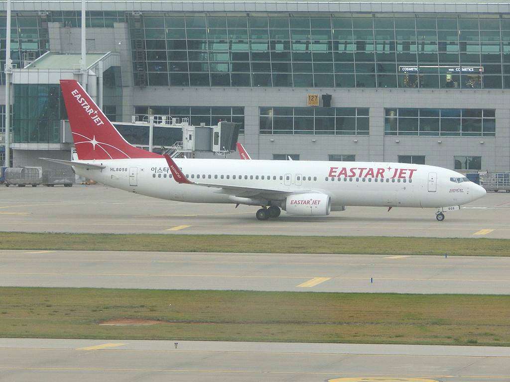 An Eastar Jet Boeing 737-8 taxies to the gate.