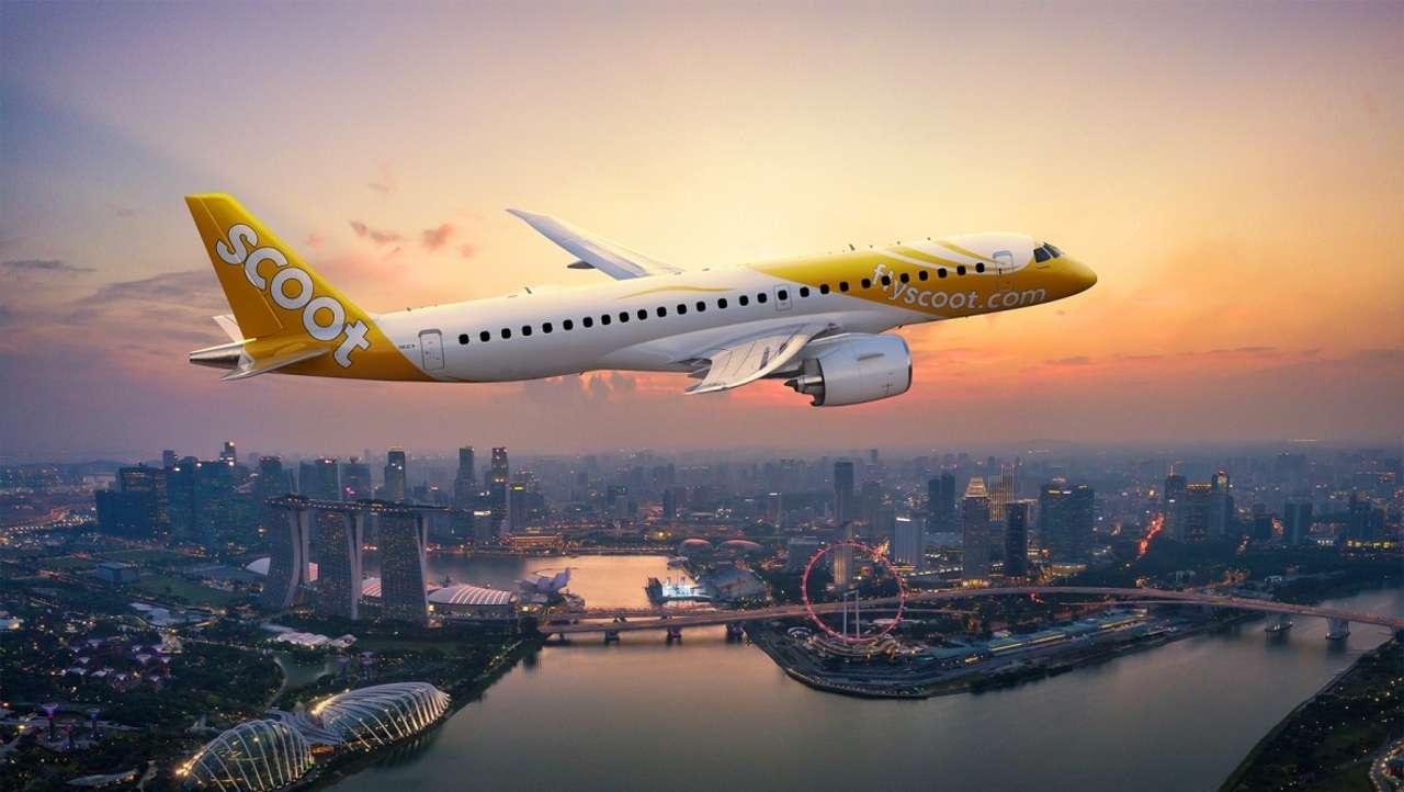Render of a Scoot Embraer E2 jet over Singapore.