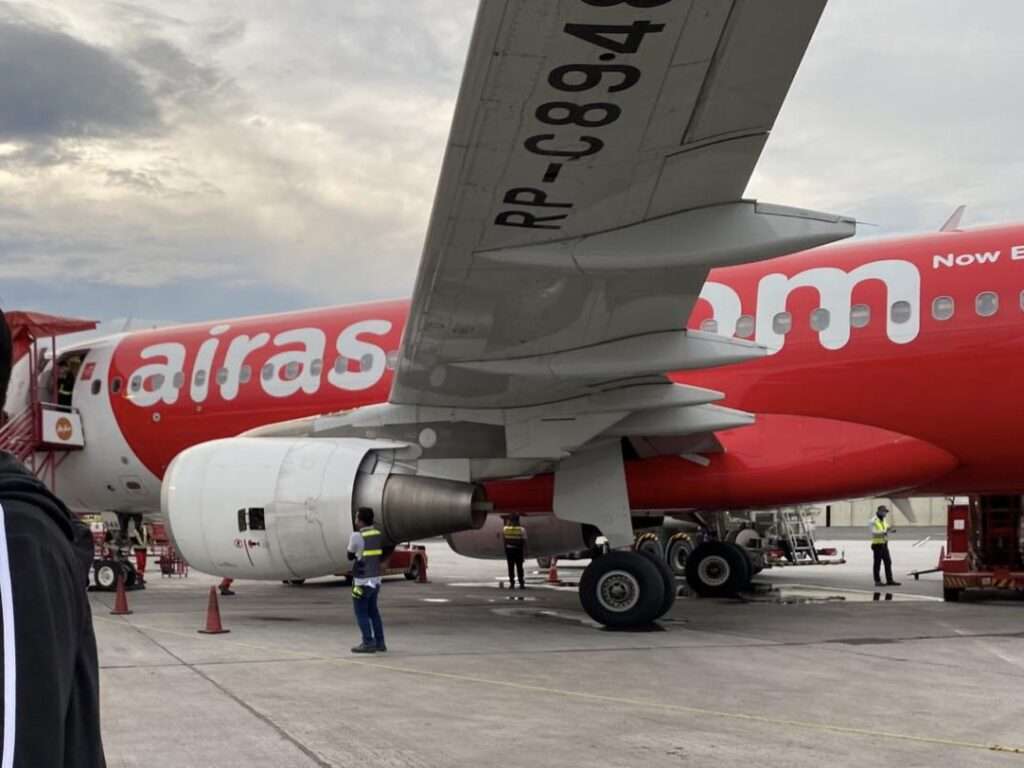 An AirAsia Philippines aircraft parked at the terminal.