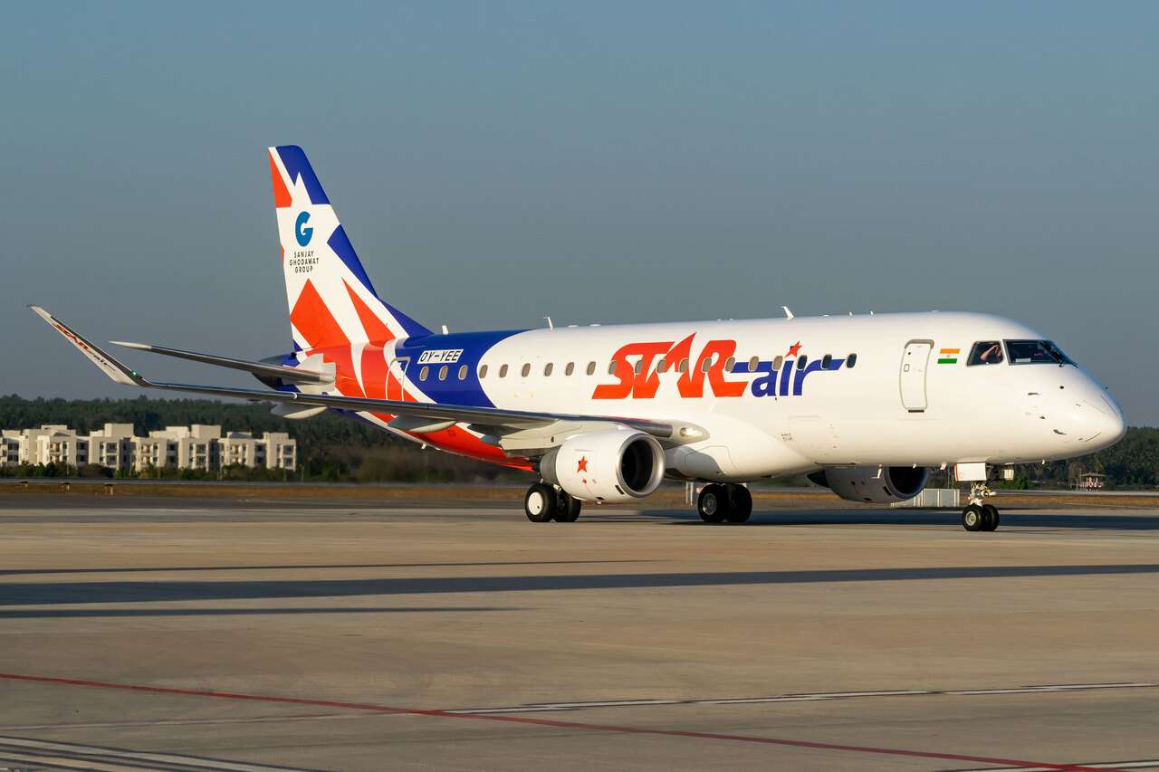 A Star Air Embraer E175 taxis to the runway.