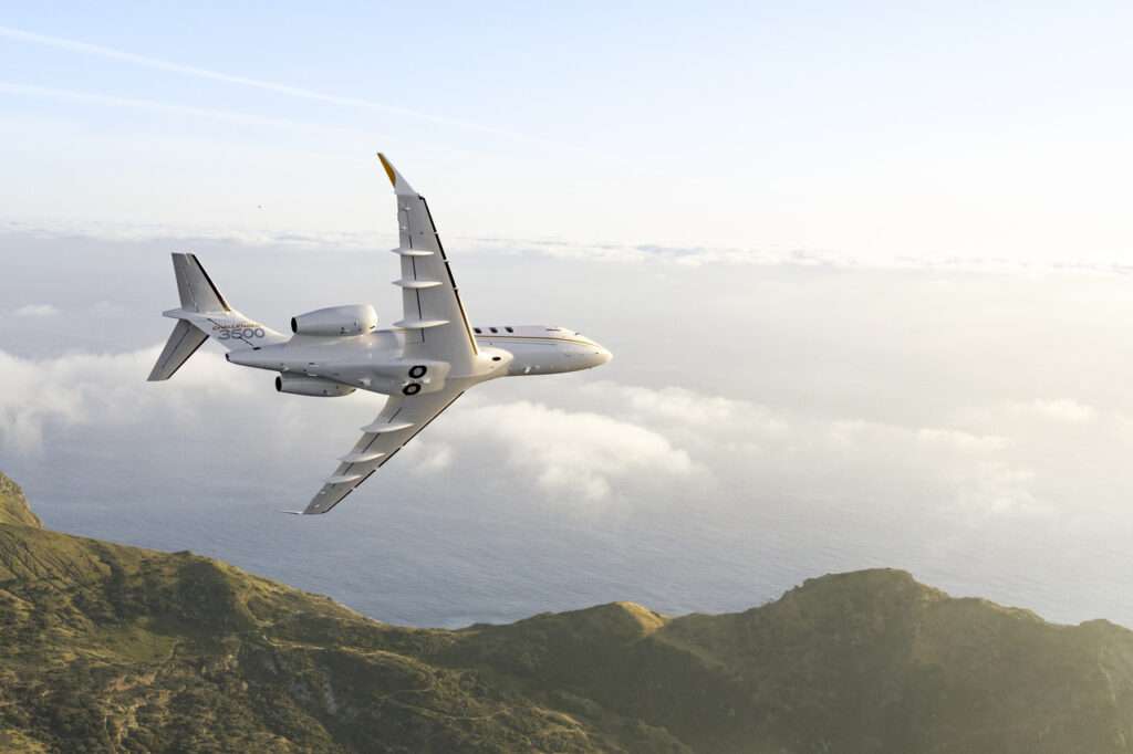 A Bombardier Challenger 3500 banks in flight.