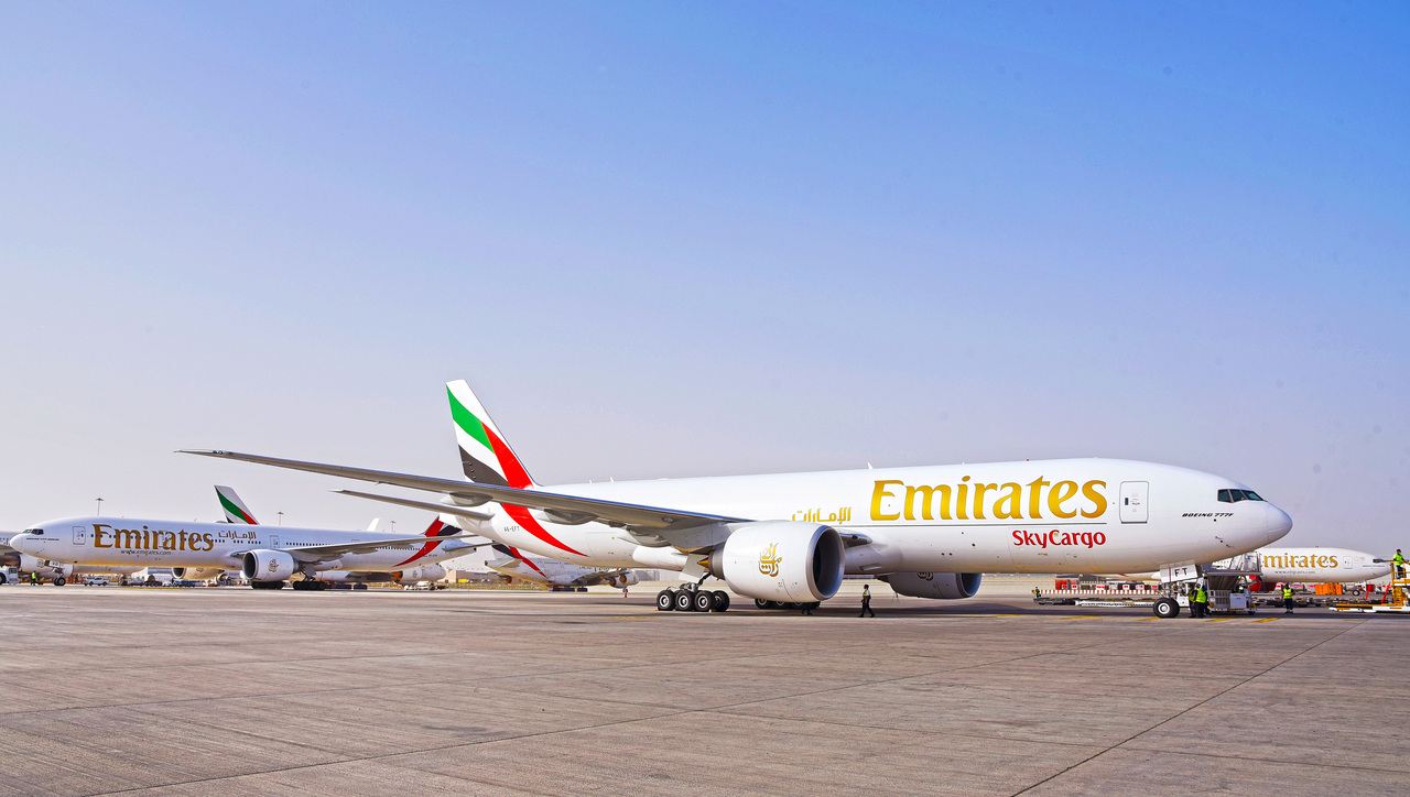 Emirates SkyCargo freighter aircraft parked on the tarmac.