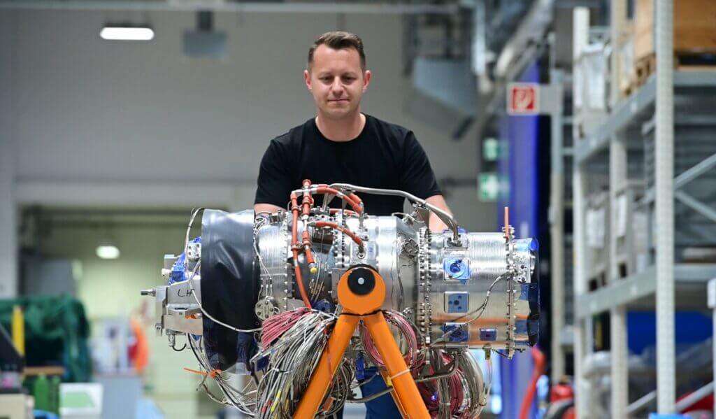 New Rolls-Royce small gas turbine engine on test stand.