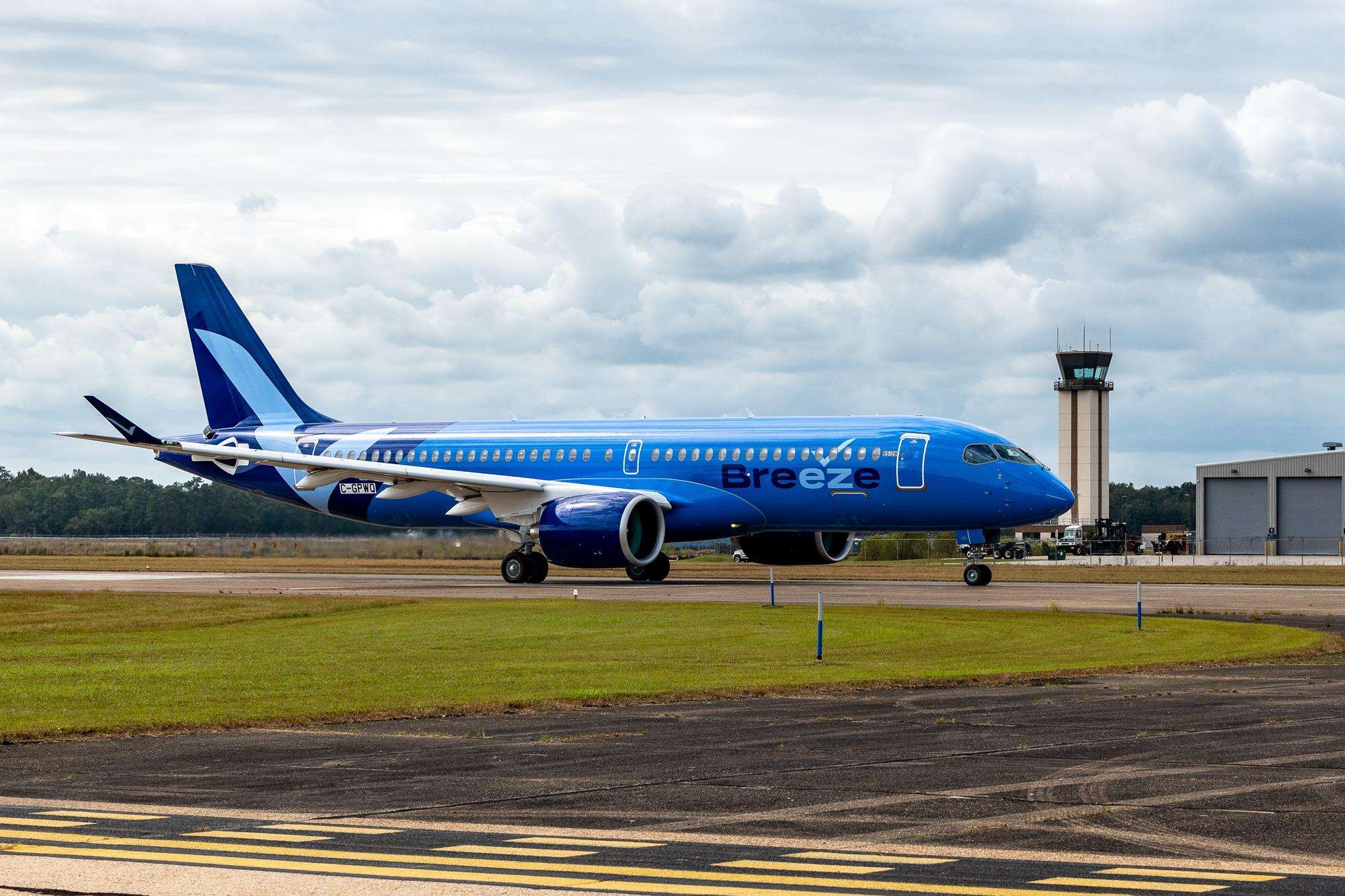 A Breeze Airways A220 on the taxiway.