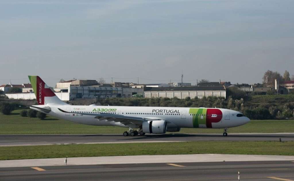 A TAP Air Portugal A330neo taxies to the terminal.