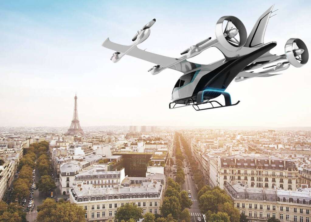 Render of an Eve Air Mobility eVTOL aircraft flying over Paris.