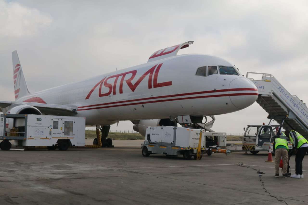 An Astral Aviation freighter is unloaded.