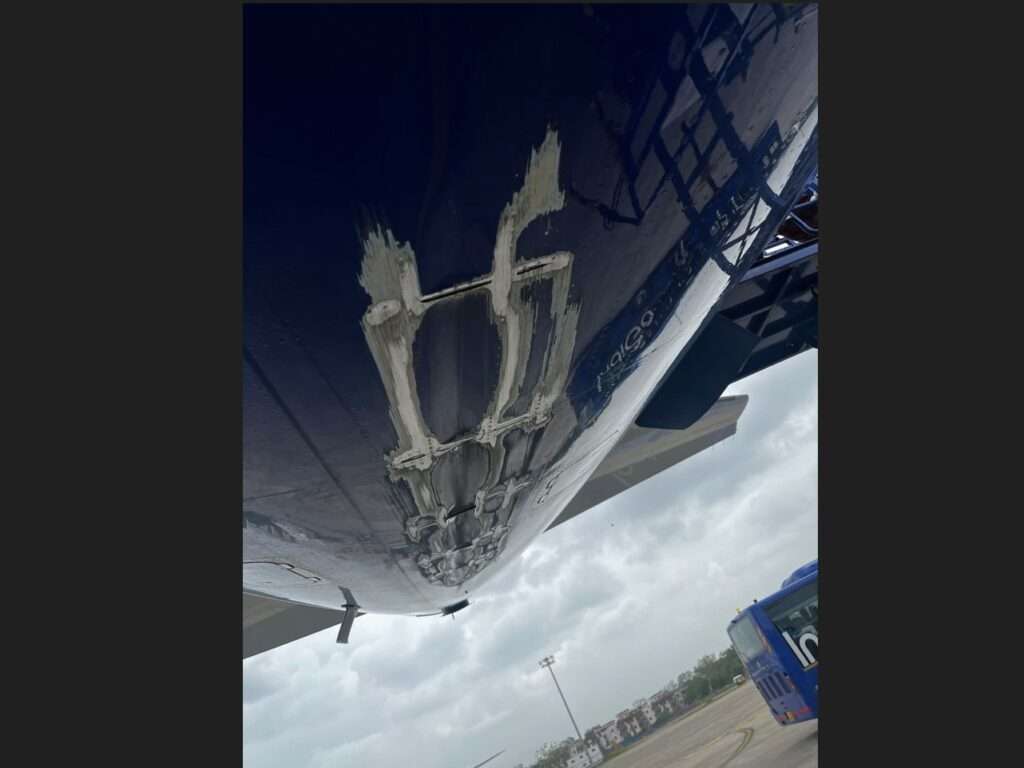 Underside of an IndiGo A321 at Ahmedabad airport showing tail strike damage.